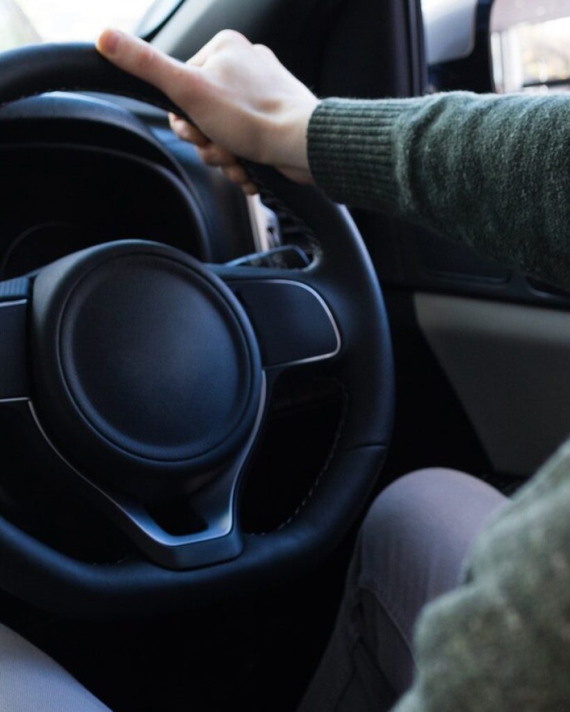 man-using-smartphone-while-driving-car.jpg
